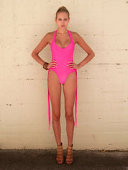 Pink One Piece SwimSuit featuring beautiful strapping detail which can flow free or be crisscrossed around the neck or waist 